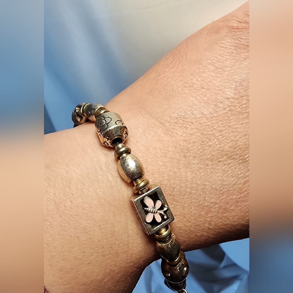 Brighton breast cancer awareness bracelet featuring a pink enamel flower charm. 
